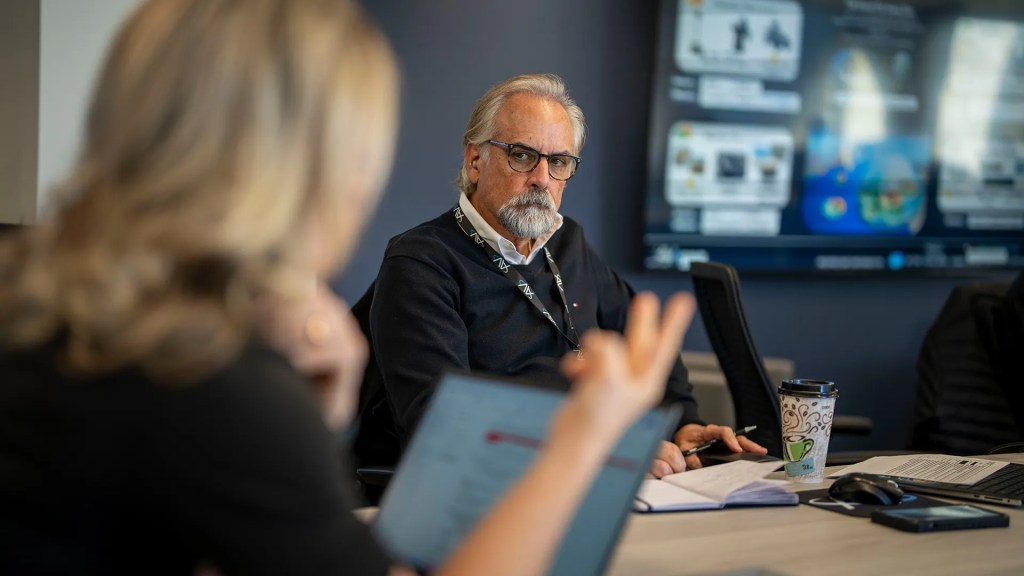AV employees in a meeting